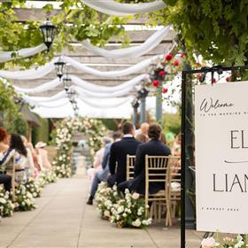 fwthumbOutdoor wedding in bedfordshire with flower arch and aisle meadow arrangements.jpg